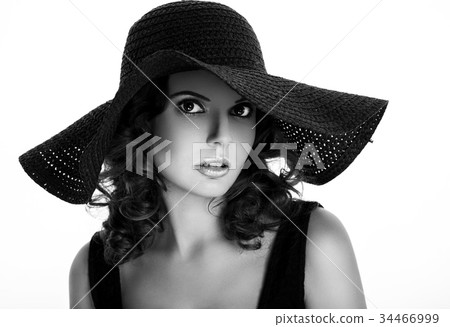 Portrait of a beautiful woman in a hat Portrait of a beautiful woman in a hat 34466999