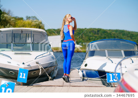 Fitness girl mooring yacht Fitness girl mooring yacht 34467695