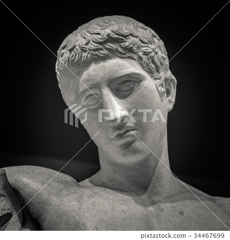 Head and shoulders detail of the ancient sculpture 34467699