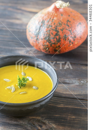 Bowl of pumpkin cream soup 34468301
