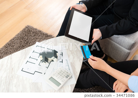 high angle view of buyer using credit card paying high angle view of buyer using credit card paying 34471086