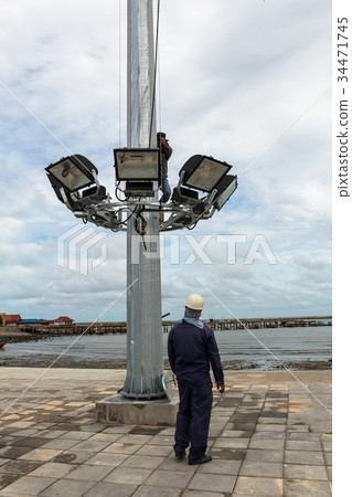 worker is maintenance sport light. worker is maintenance sport light. 34471745