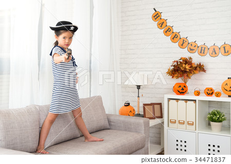 captain girl holding a pirate toy gun 34471837