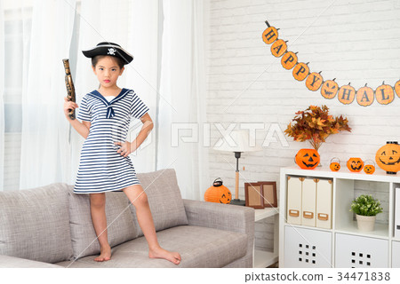 confidence girl holding a pirate toy pistol 34471838