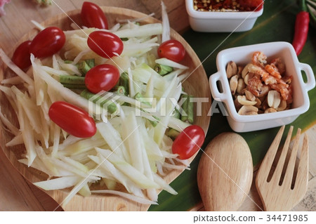 Spicy papaya salad is delicious ,thai food. Spicy papaya salad is delicious ,thai food. 34471985