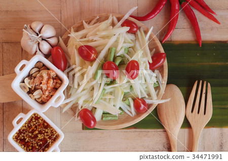 Spicy papaya salad is delicious ,thai food. Spicy papaya salad is delicious ,thai food. 34471991