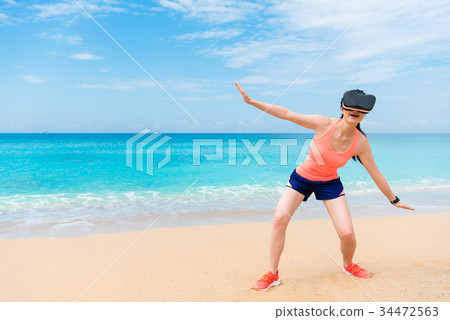 elegant young sporty woman playing fun with VR elegant young sporty woman playing fun with VR 34472563