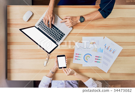 Freelance is brainstorming on work with computer. Freelance is brainstorming on work with computer. 34473082