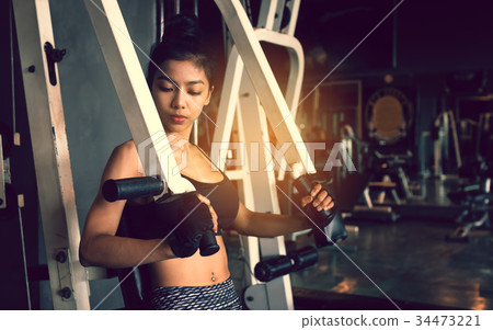 Asian sporty woman exercise gym club. 34473221