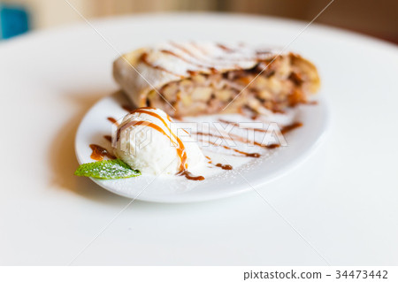 The close-up side view of the ice cream with mint 34473442