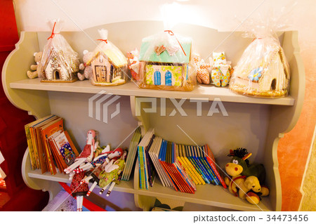 Close-up view of the shelves with books, colourful Close-up view of the shelves with books, colourful 34473456