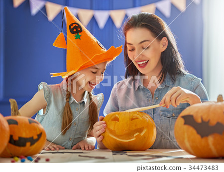 family preparing for Halloween. 34473483