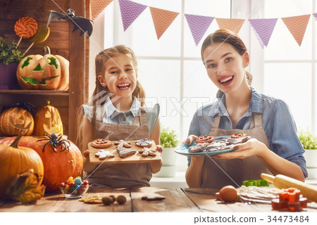 family preparing for Halloween. 34473484