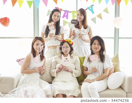 Woman enjoying a baby shower 34474256