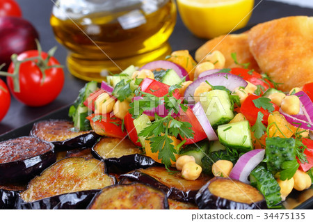 chickpea Salad with eggplants, vegetables and pita 34475135