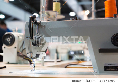 Overlock machine closeup, nobody, clothing sew Overlock machine closeup, nobody, clothing sew 34475260