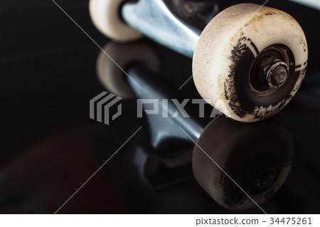 Skateboard truck and wheels on glance background Skateboard truck and wheels on glance background 34475261
