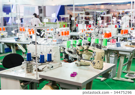 Dressmaker workplace, sewing machines on factory Dressmaker workplace, sewing machines on factory 34475296