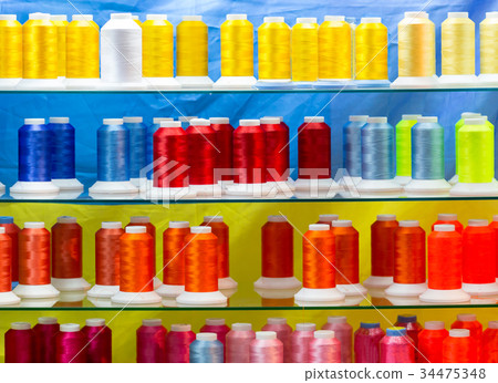 Spools of new color threads, sewing equipment 34475348