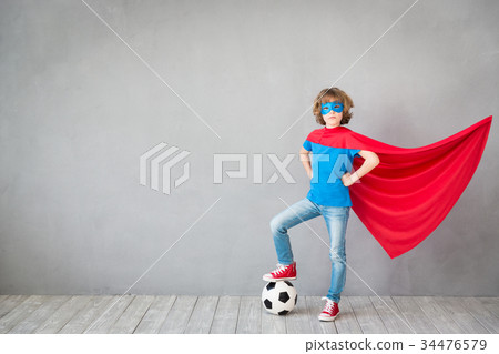 Child pretend to be soccer superhero 34476579