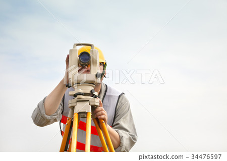 Surveyor engineer making measure Surveyor engineer making measure 34476597