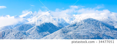 Mountains peaks and blue sky with clouds 34477051
