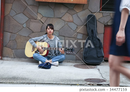 Street musician woman Street musician woman 34477159