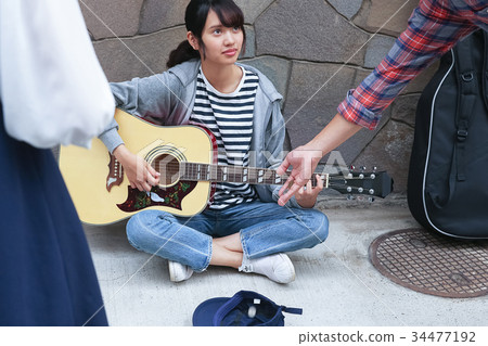 Street musician woman Street musician woman 34477192