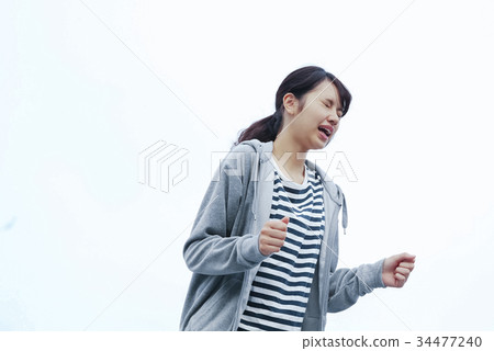 A woman shouting 34477240