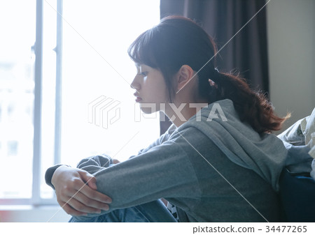 A woman relaxing in the room 34477265