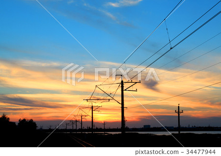 Photo of a brightly beautiful sunset with clouds  34477944