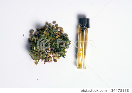 Medicinal cannabis with extract oil in a bottle 34478188