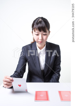 Woman in a suit (focus on a card) 34479105