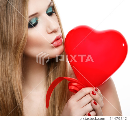 Portrait of a beautiful woman with a red balloon Portrait of a beautiful woman with a red balloon 34479842