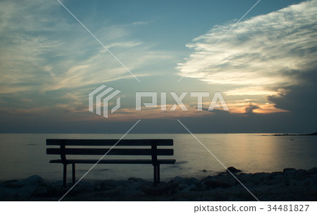 Bench by the sea at sunset Bench by the sea at sunset 34481827