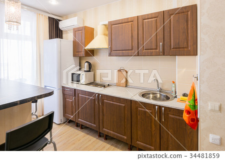 Interior of a modern spacious inexpensive kitchen 34481859