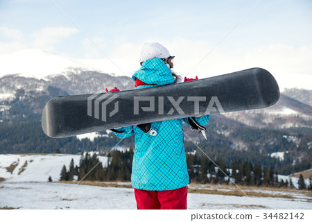 snowboarder girl standing with snowboard, snowboarder girl standing with snowboard, 34482142