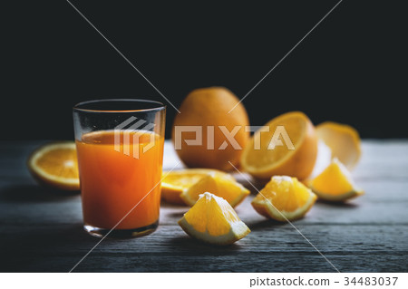 Orange juice and Orange slices on wooden. Orange juice and Orange slices on wooden. 34483037