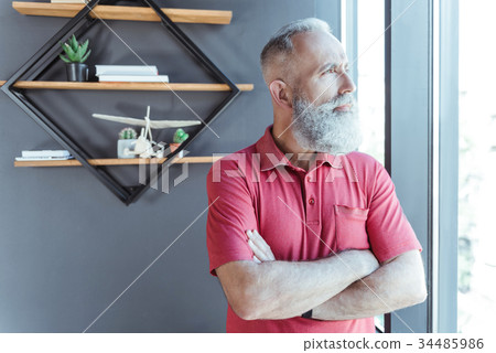 Stylish gray-haired elderly male is resting in Stylish gray-haired elderly male is resting in 34485986