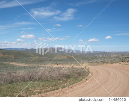 Dirt path leading to the wilderness Dirt path leading to the wilderness 34486020