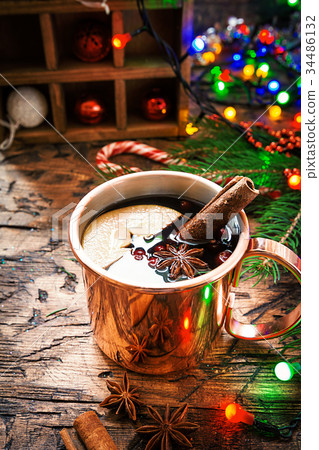 Mulled wine in copper mug. 34486132