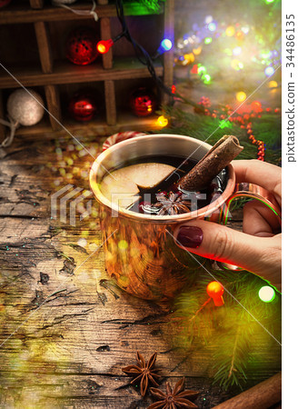 Mulled wine in copper mug. Mulled wine in copper mug. 34486135
