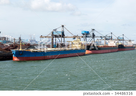 Dry cargo terminal with cargo ships. Dry cargo terminal with cargo ships. 34486316