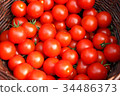Group of organic tomatoes in a basket. 34486373
