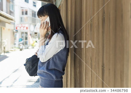 High school girl smartphone call 34486798