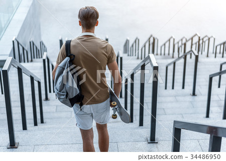 Teenager keeping board in arm 34486950