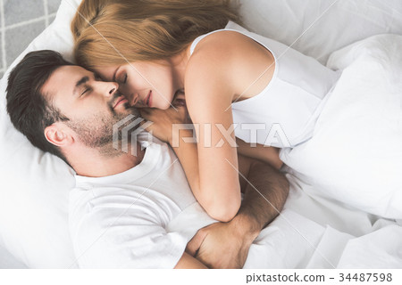 Affectionate man and woman napping at home Affectionate man and woman napping at home 34487598