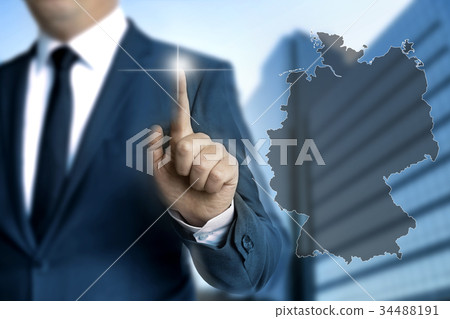 Germany map touchscreen is operated by businessmen Germany map touchscreen is operated by businessmen 34488191