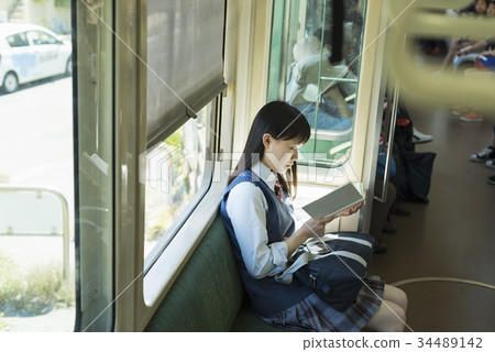 High school girl attending school train 34489142