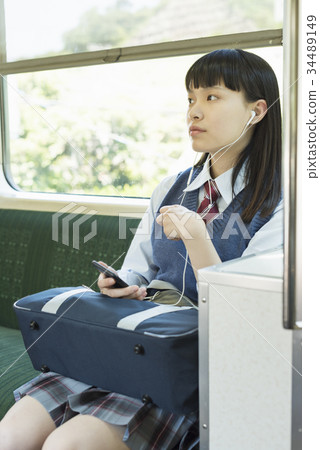 High school girl attending school train 34489149